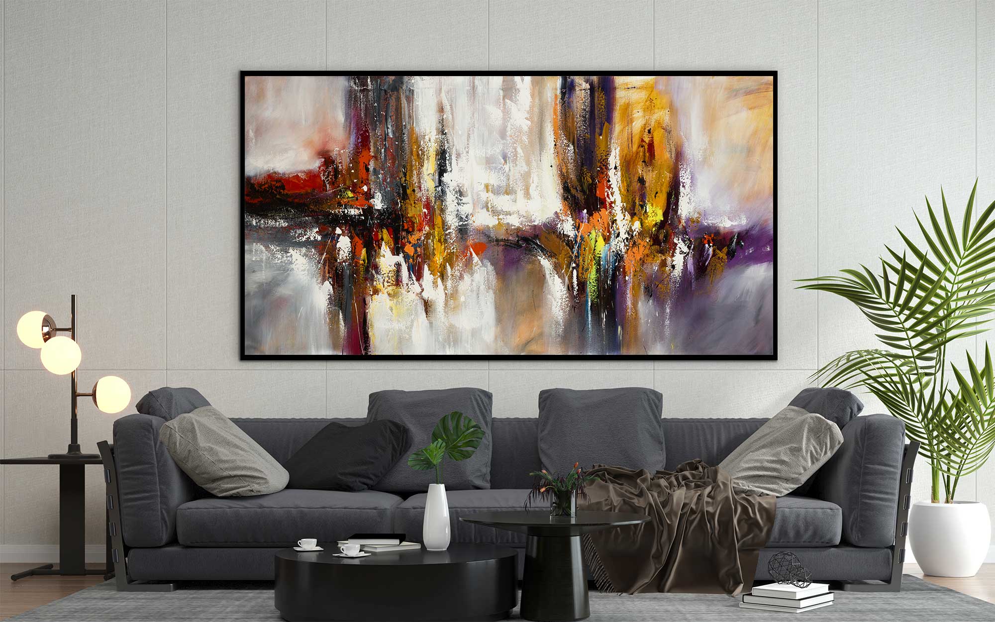 Dancing Together abstract painting above dark grey sofa