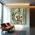 Tidal Echoes circular abstract painting displayed in a modern interior with leather chairs